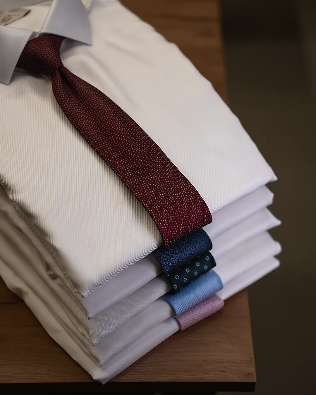 Bespoke shirts folded at the atelier