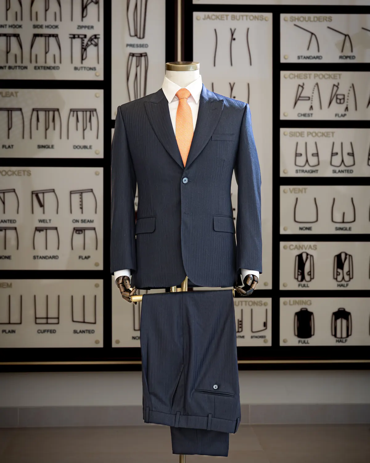 Bespoke navy suit on a tailor's form