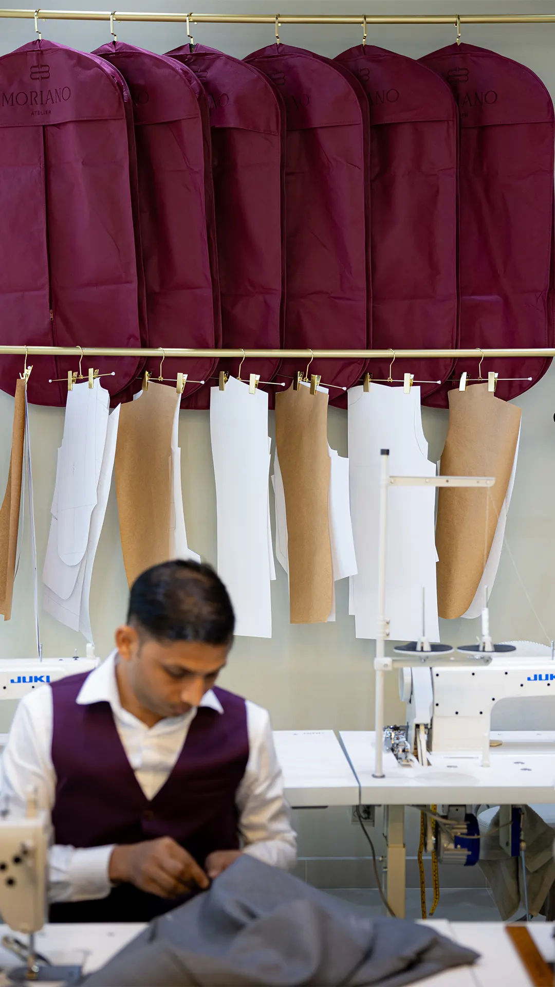 A tailor at work in the MORIANO workroom
